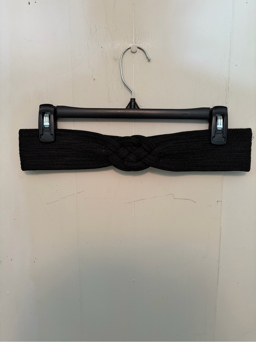 Black velcro belt with braided/plait center detail. Tag size M/L.